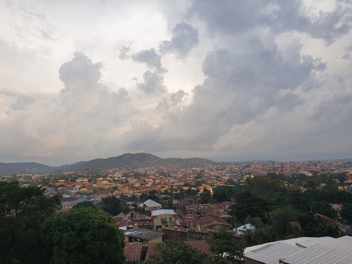 Late afternoon life across Jos streets, fields, and skylines