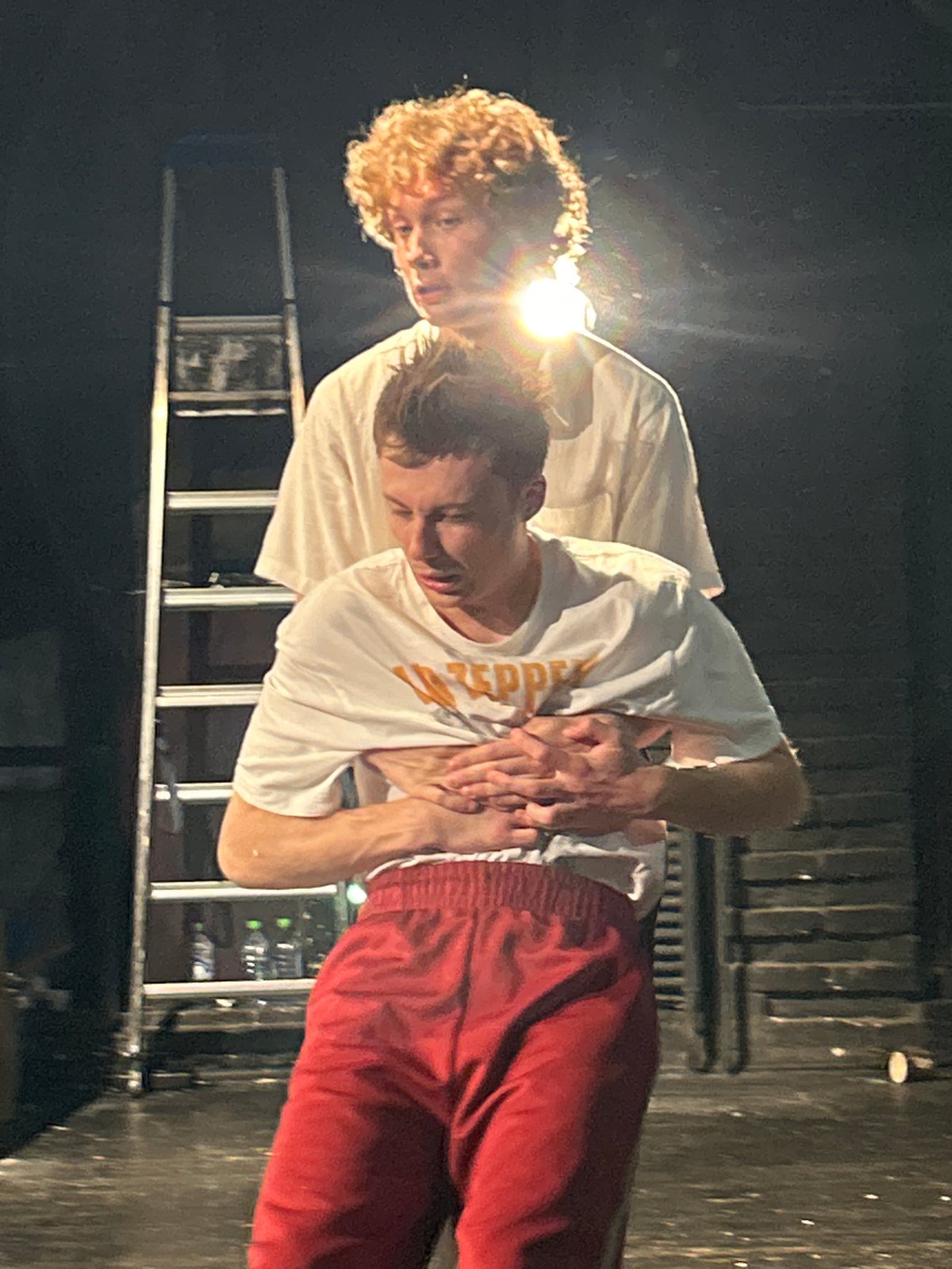 Stage performance unfolds in a small theater, June 2026