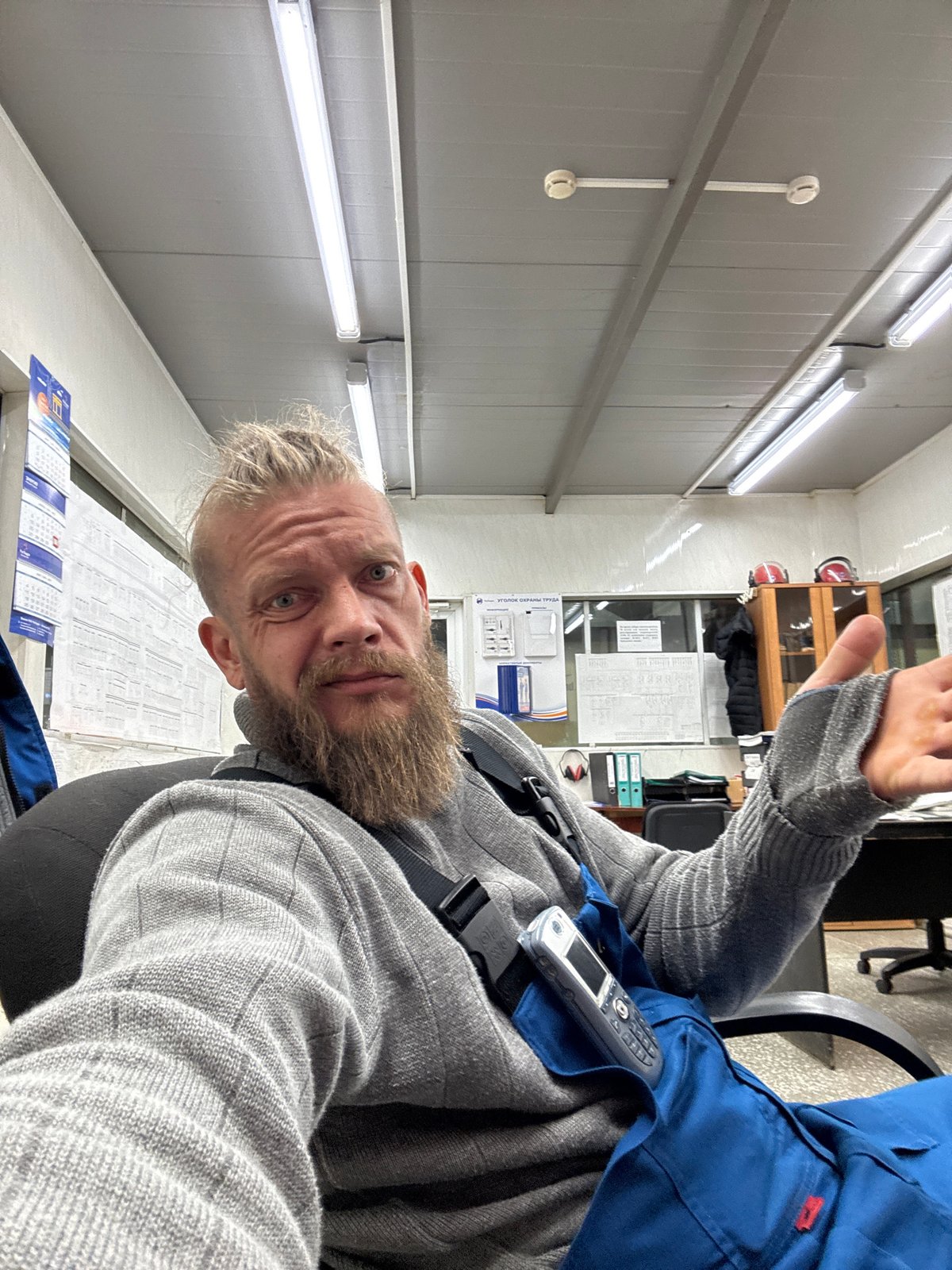 Worker with radio observed in office setting