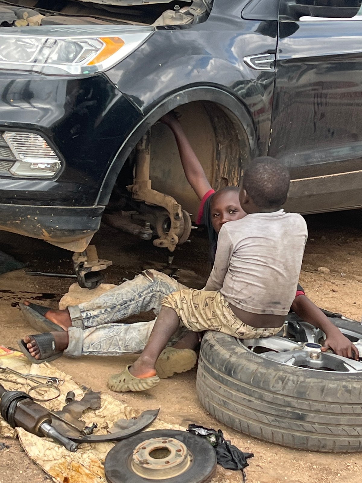 Everyday life across Jos streets, workshops, and small businesses