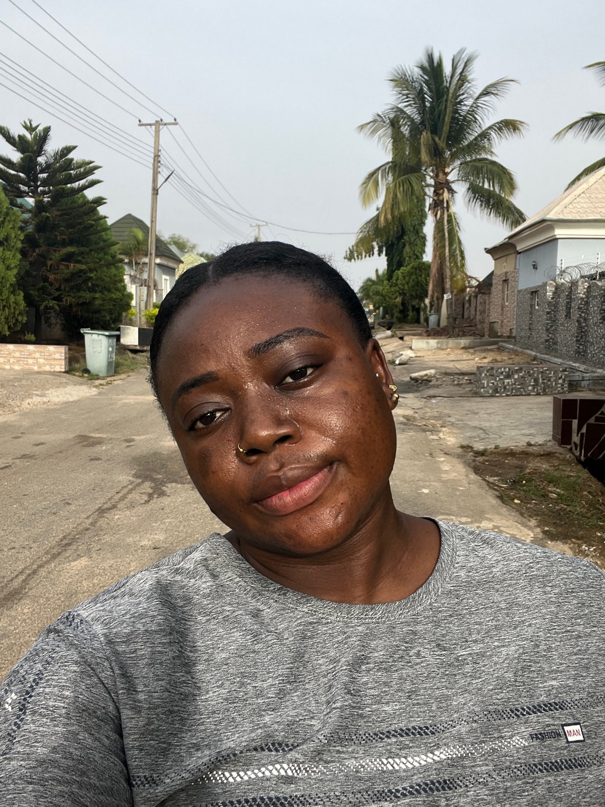 Morning street life documented across Abuja residential areas