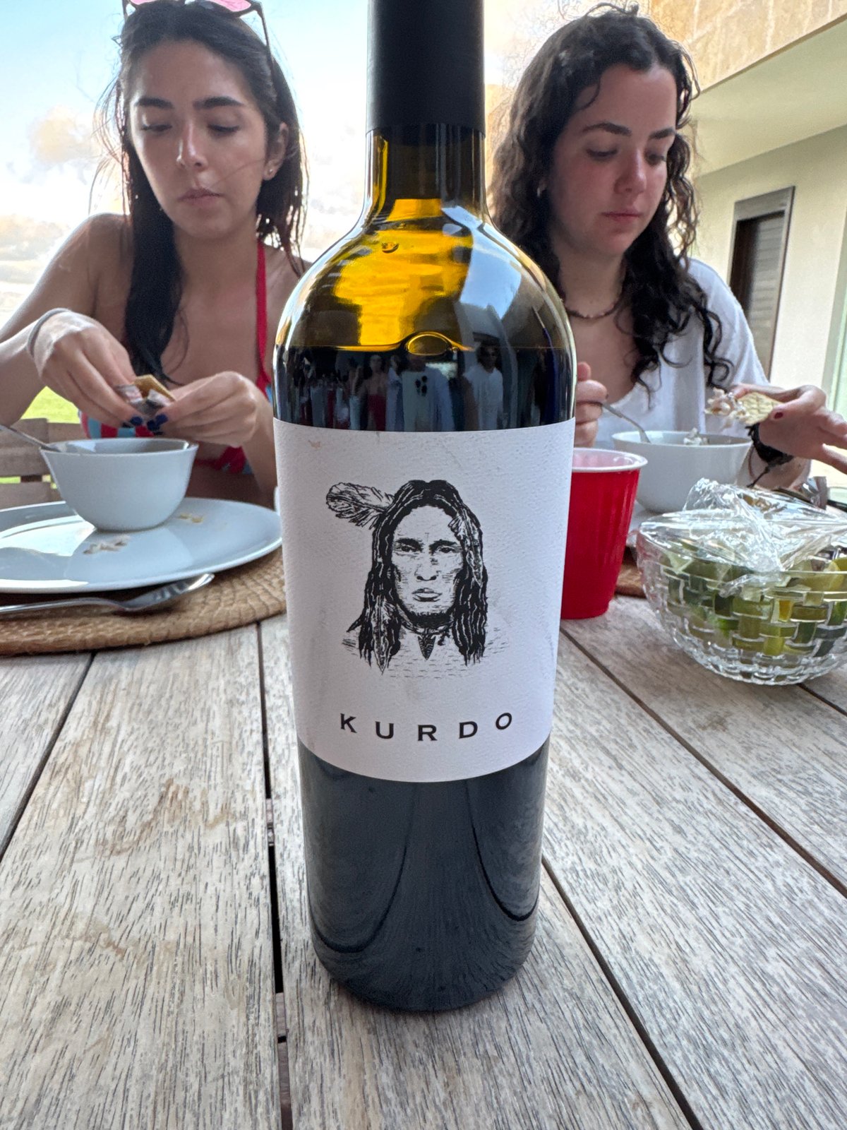 Young adults dine outdoors in Mata de Uva patio