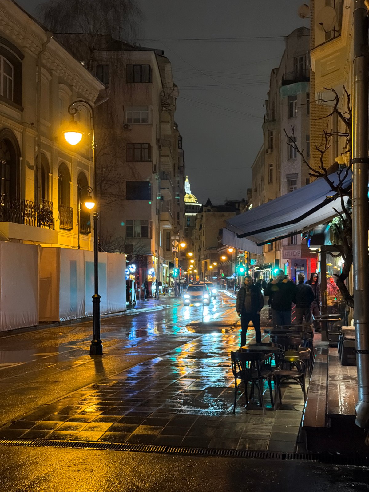 Wet Moscow street captured after evening rainfall