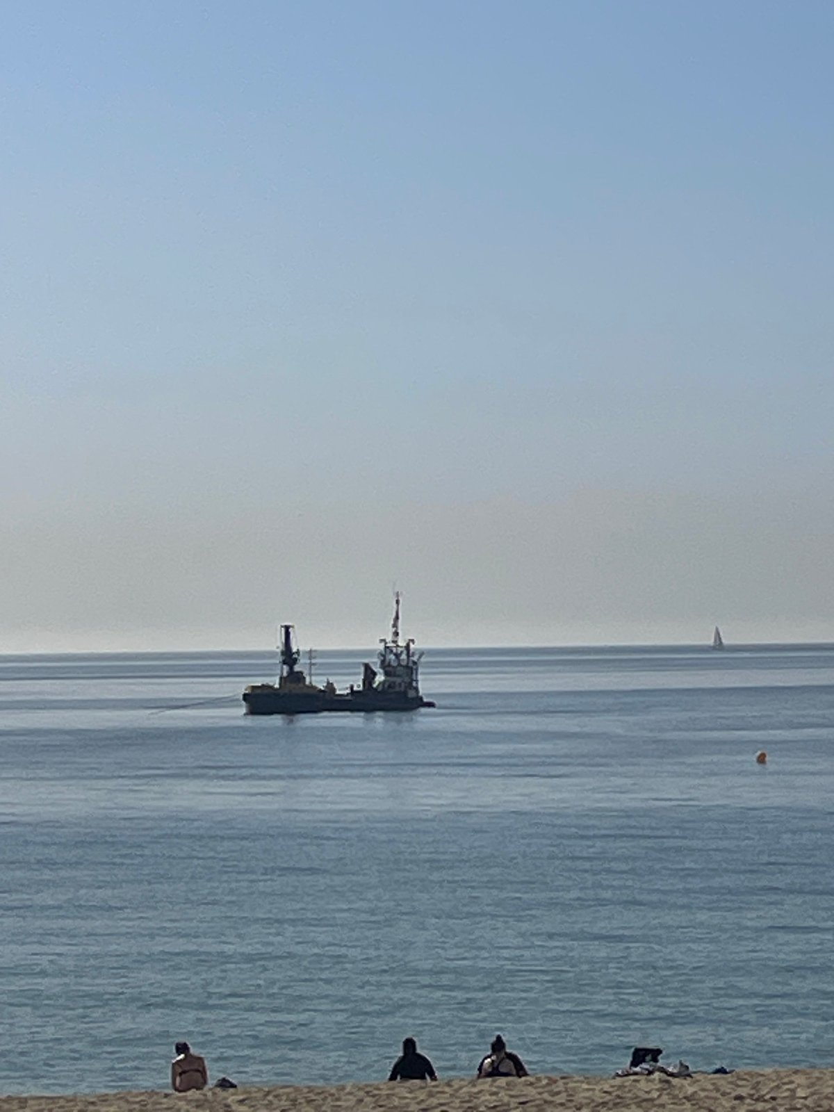 Morning beach activities captured at Barcelona's Barceloneta