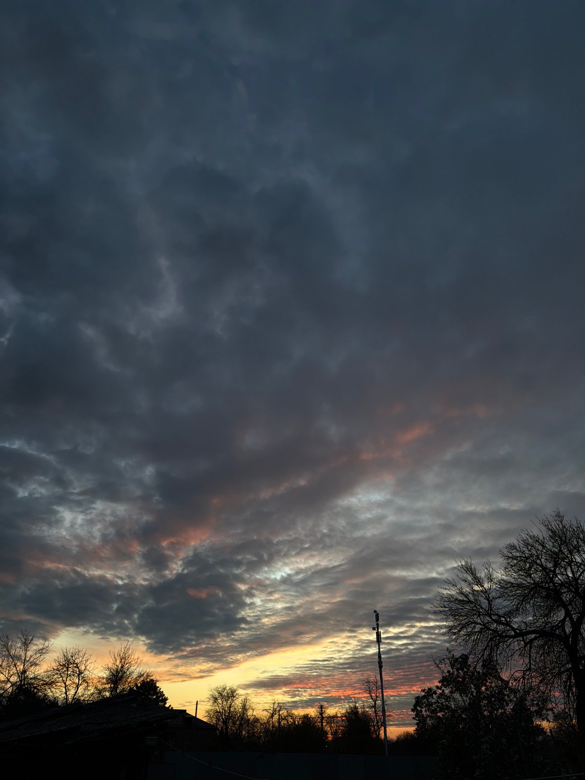 Sunset with striated clouds observed in Komsomolskiy, Russia