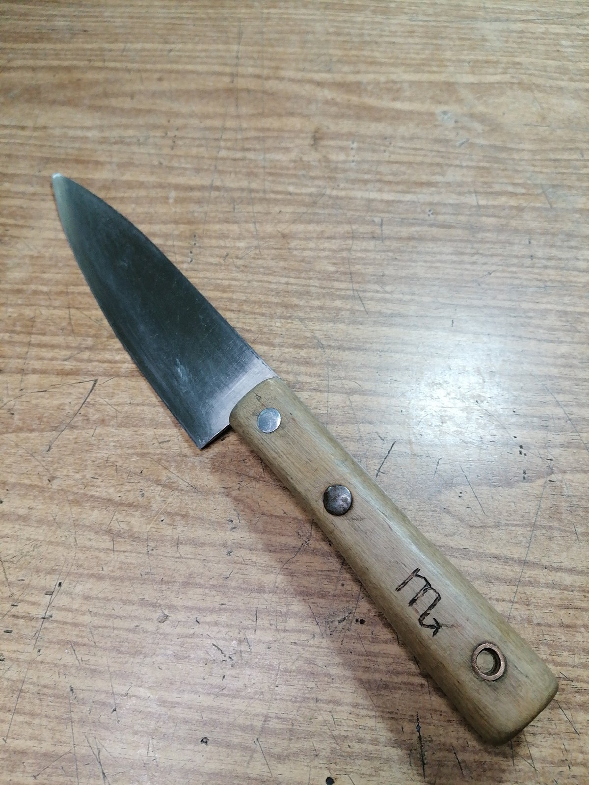 Handmade knives, amber stones, and curiosities on a Rostov workbench