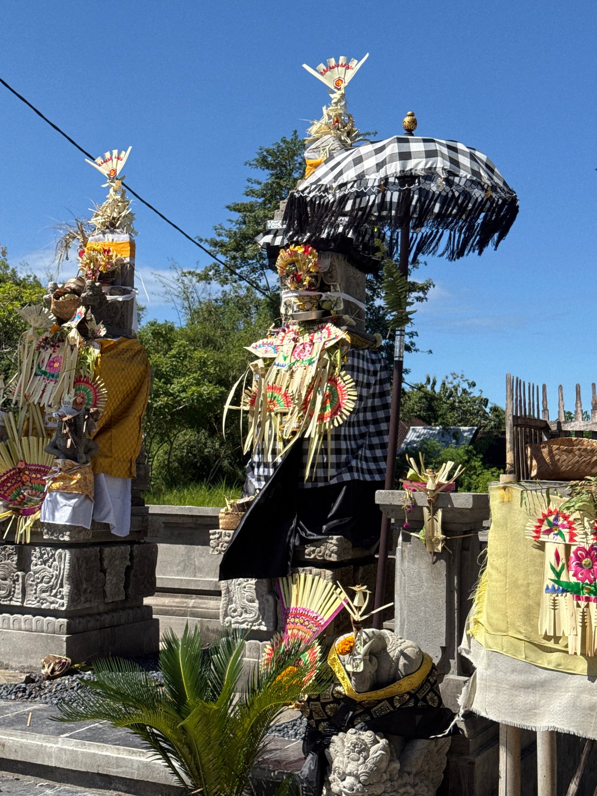 Traditional Balinese Hindu shrine documented with ceremonial offerings