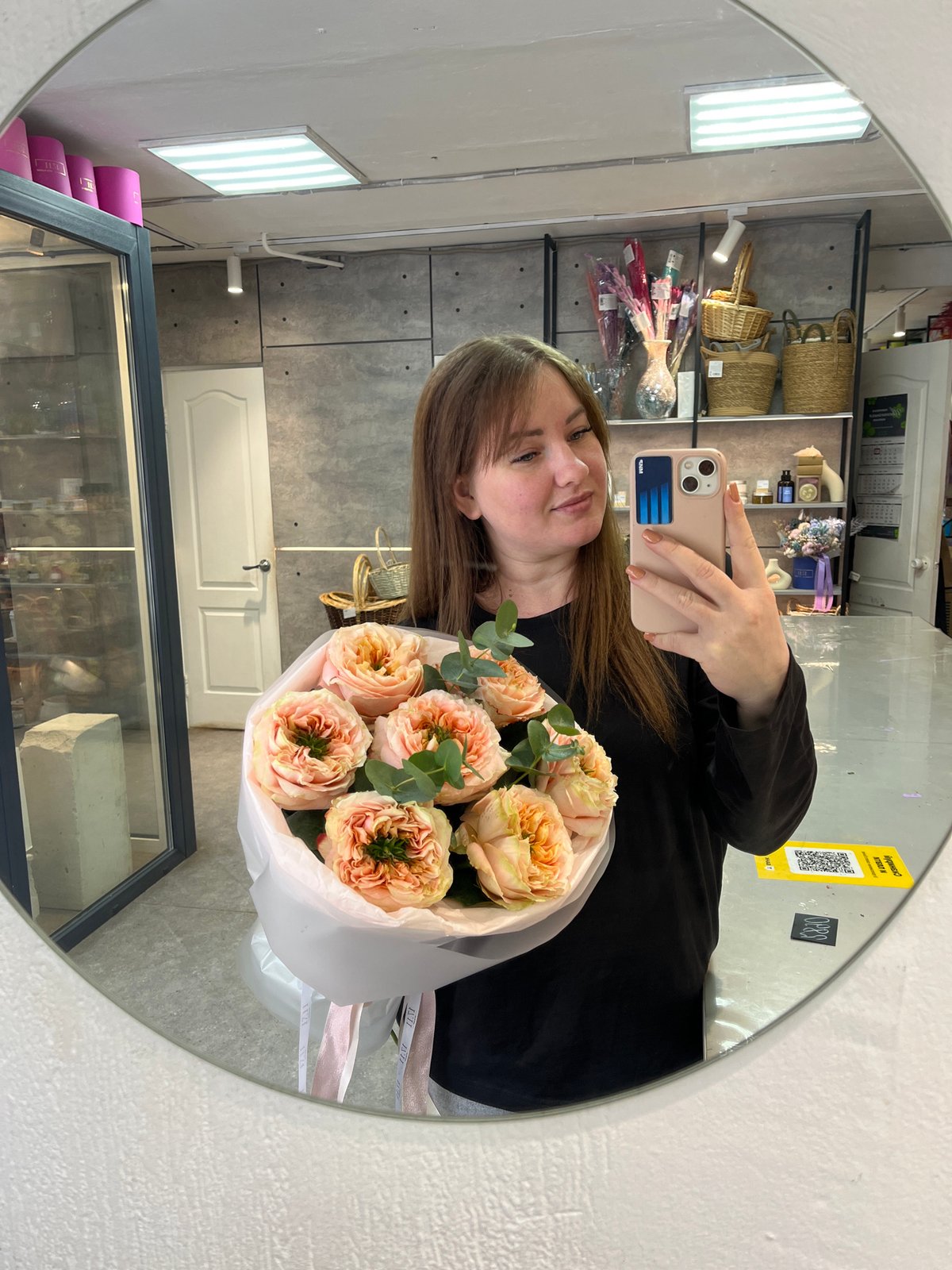 Woman takes selfies with baby on snowy Chaikovsky street