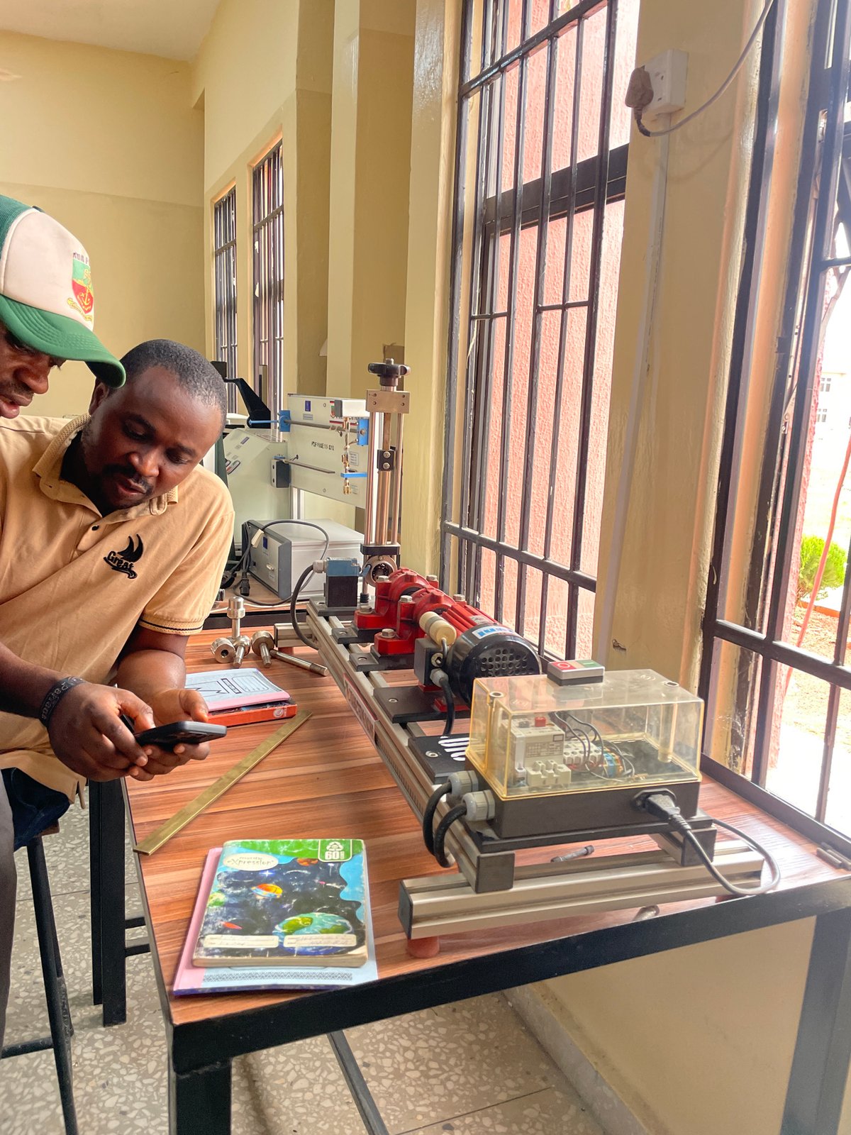 Scientific demonstration with polariscope held in Afaka classroom