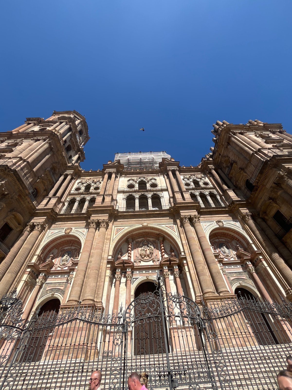 Tourist documents Málaga Cathedral and city streets in Spain