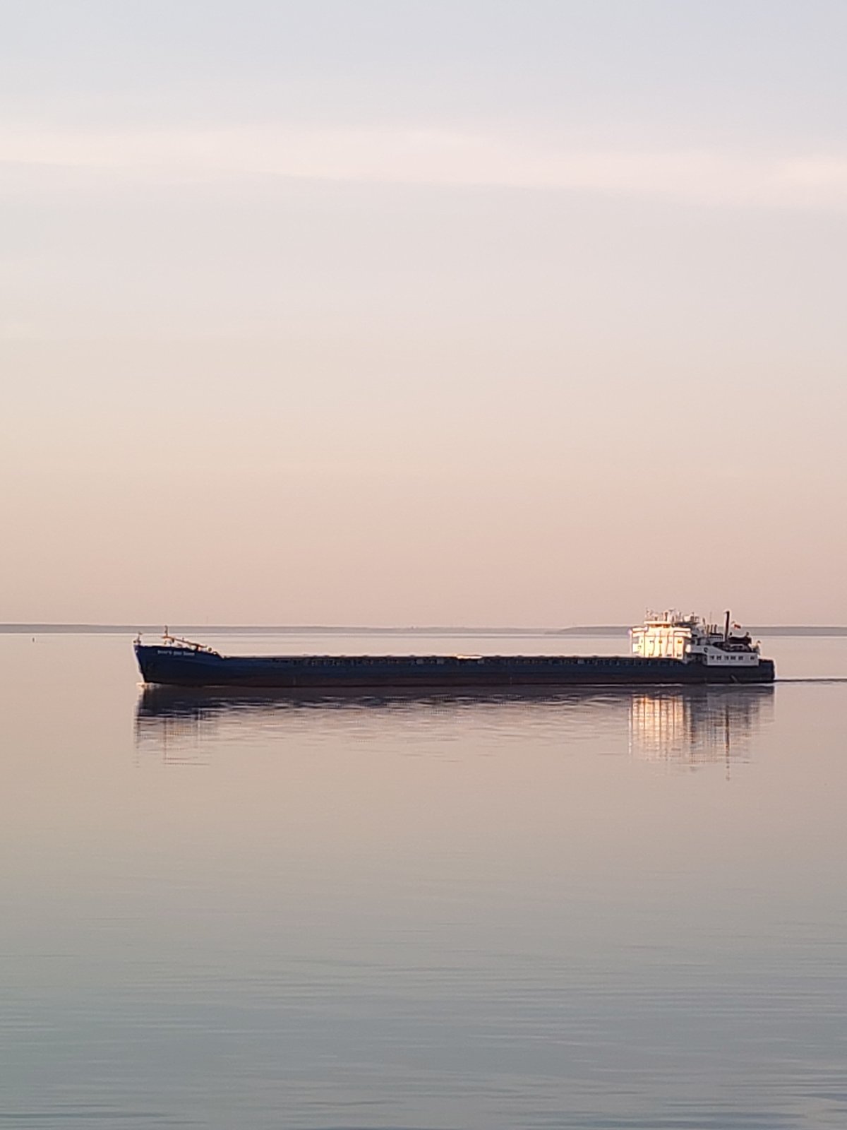 Cargo ship spotted on calm waters near Gorokhovo, Russia