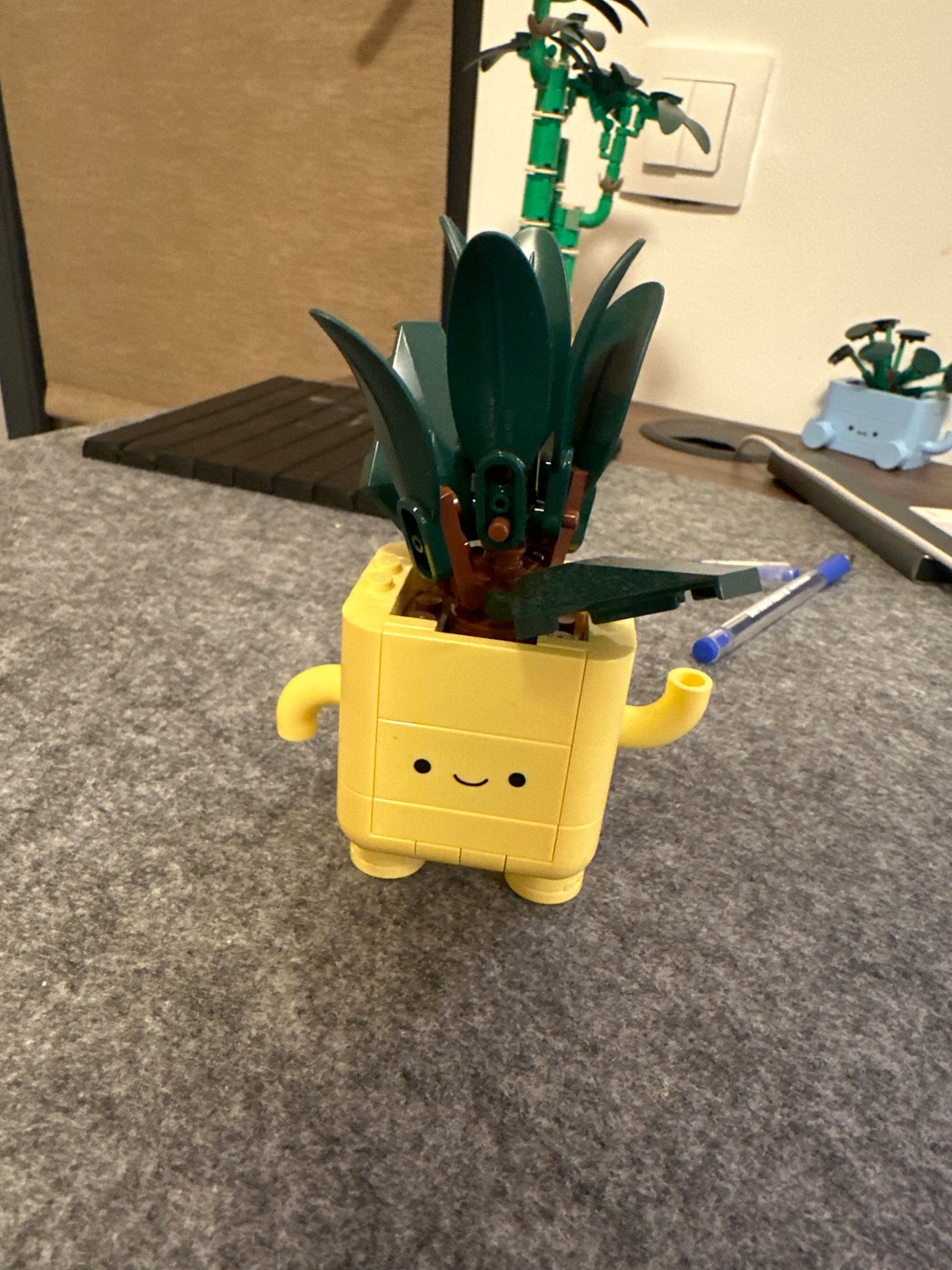 Lego pineapple head spotted on gray surface in Sofia