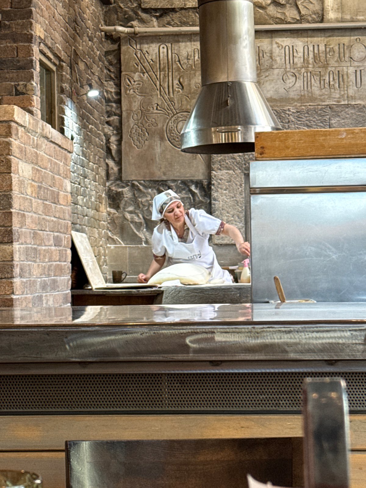 Traditional food preparation and dining captured at Yerevan restaurant