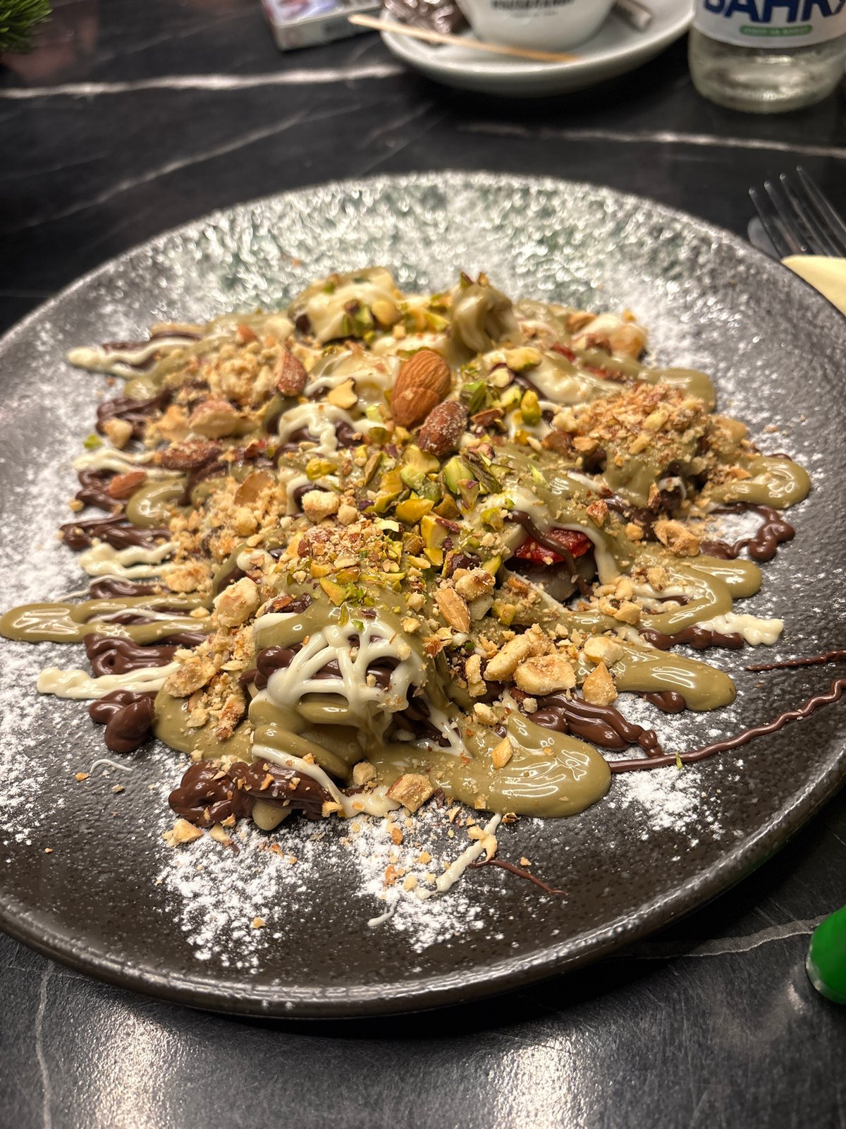 Elaborate multi-sauce dessert observed at mystery coordinates