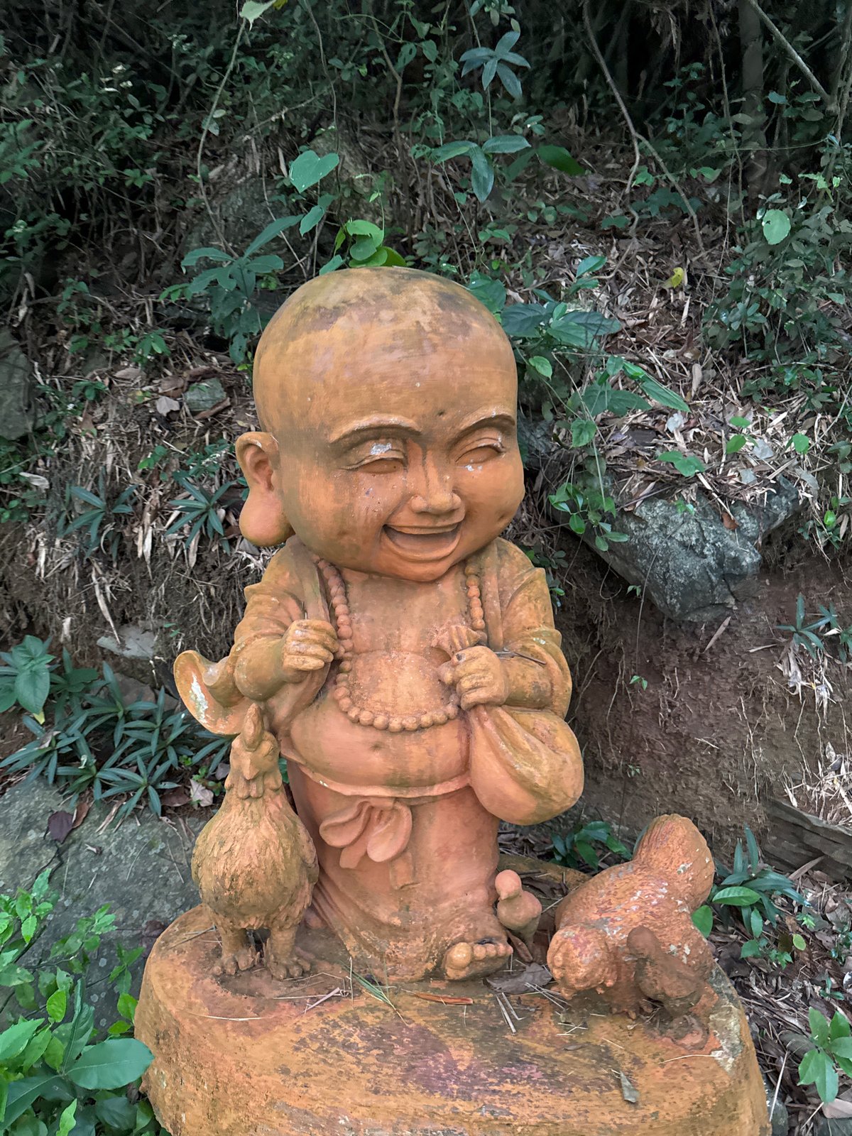 Visitors document Buddhist statues during Vesak temple tour Vietnam
