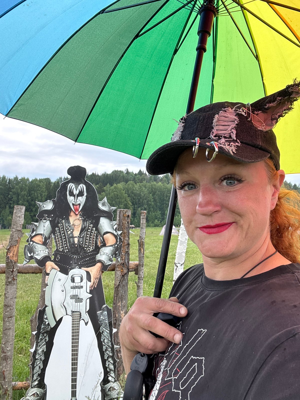 Woman and KISS cutout photographed in Russian village