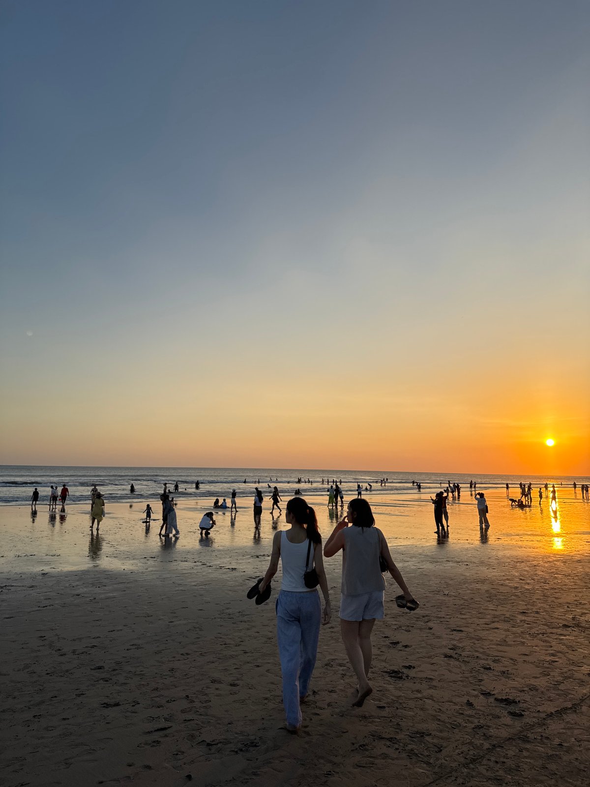 Kuta Beach sunset crowd, street scenes, and shoreline activity