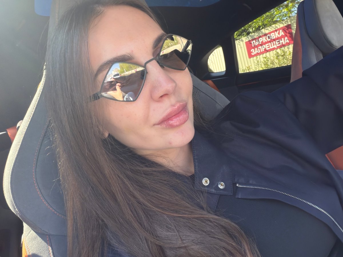 Woman in car observed near parking prohibition sign in Krasnoyarsk