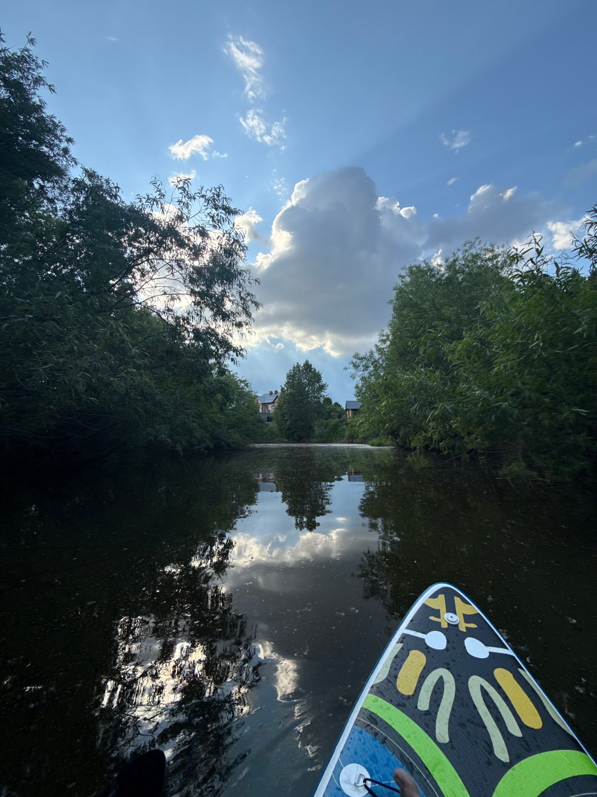 Paddleboarder enjoys serene river journey near Kondratovo, Russia