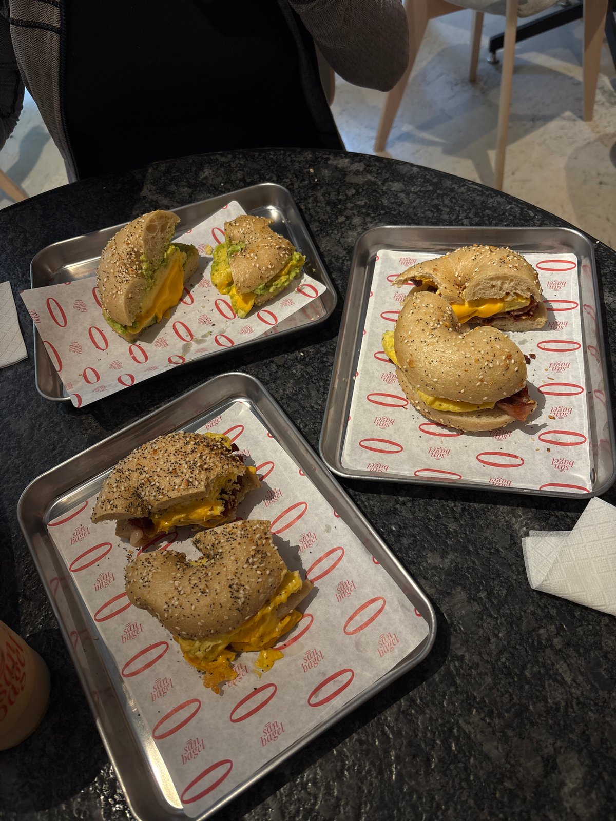 Witness documents bagel restaurant visit, captures food and dining scenes