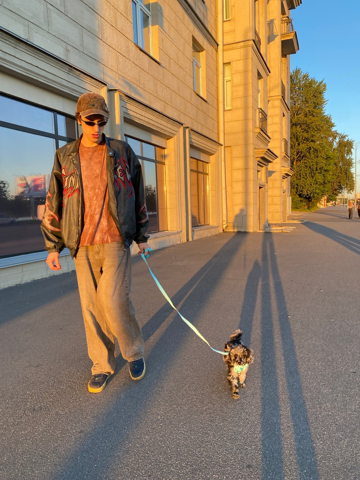 Golden-hour dog walk through a Saint Petersburg residential neighborhood