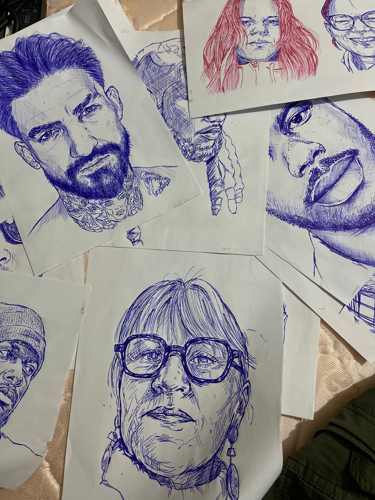 Ballpoint pen portrait sketches laid out in Jos, Nigeria