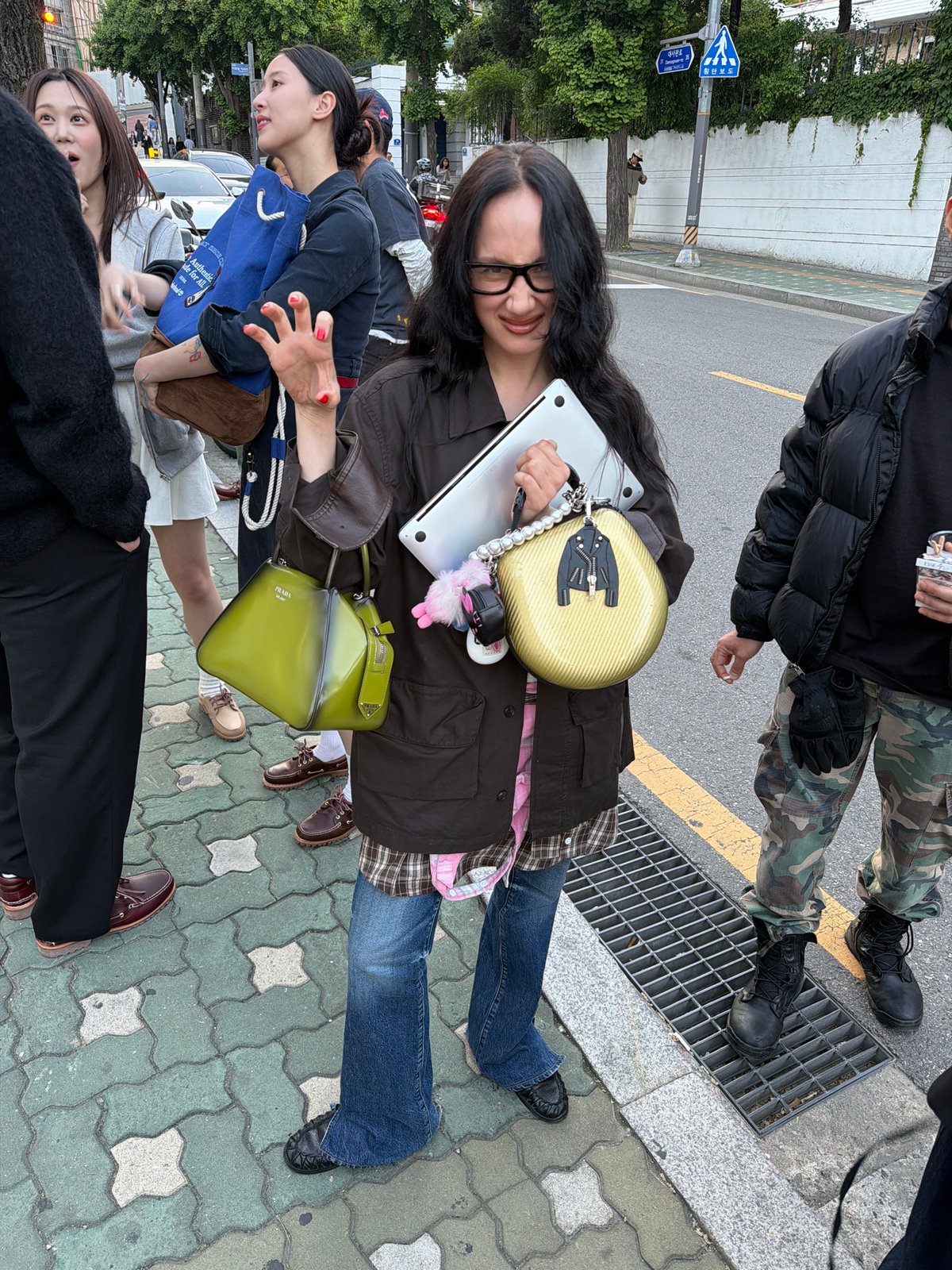 Seoul street scenes: woman with laptop, shoes on display