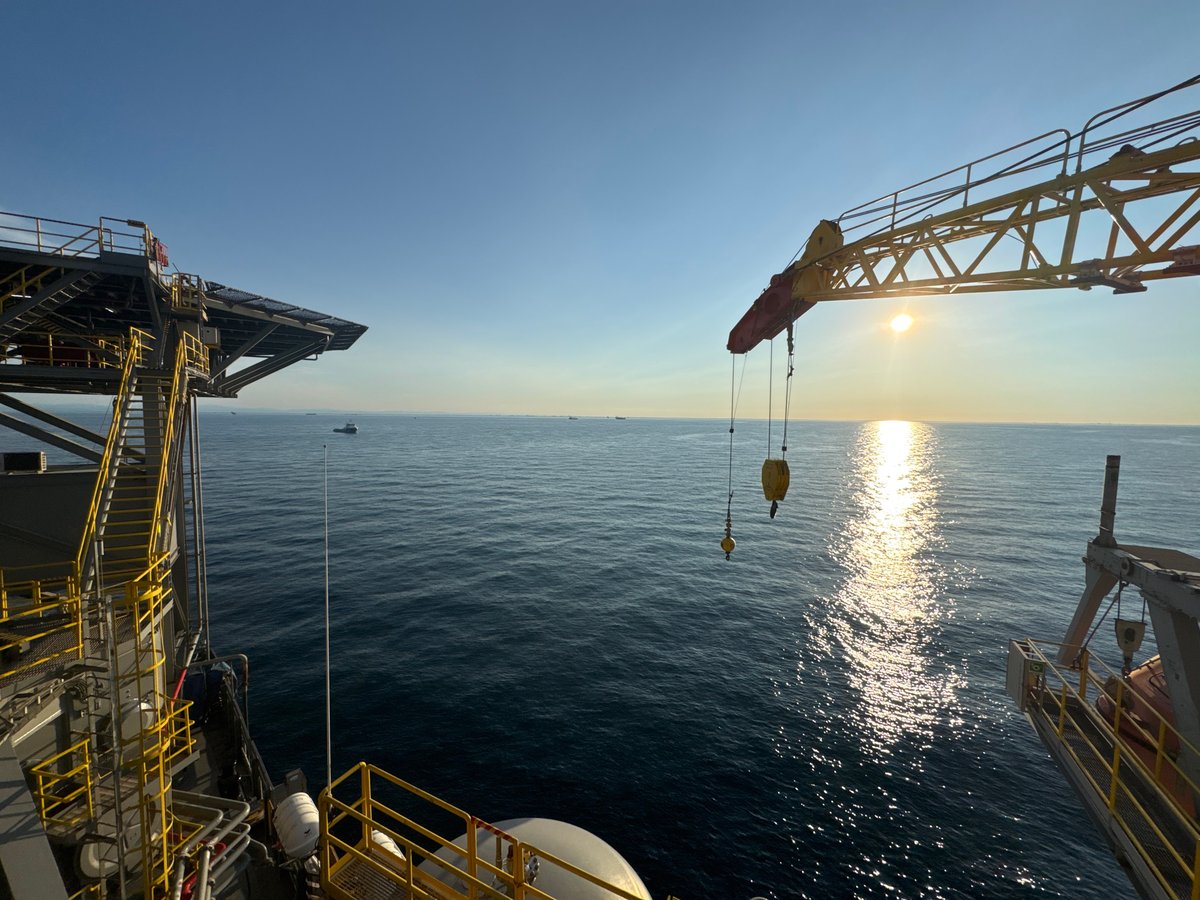 Offshore oil rig off Italy, aerial and sunrise angles