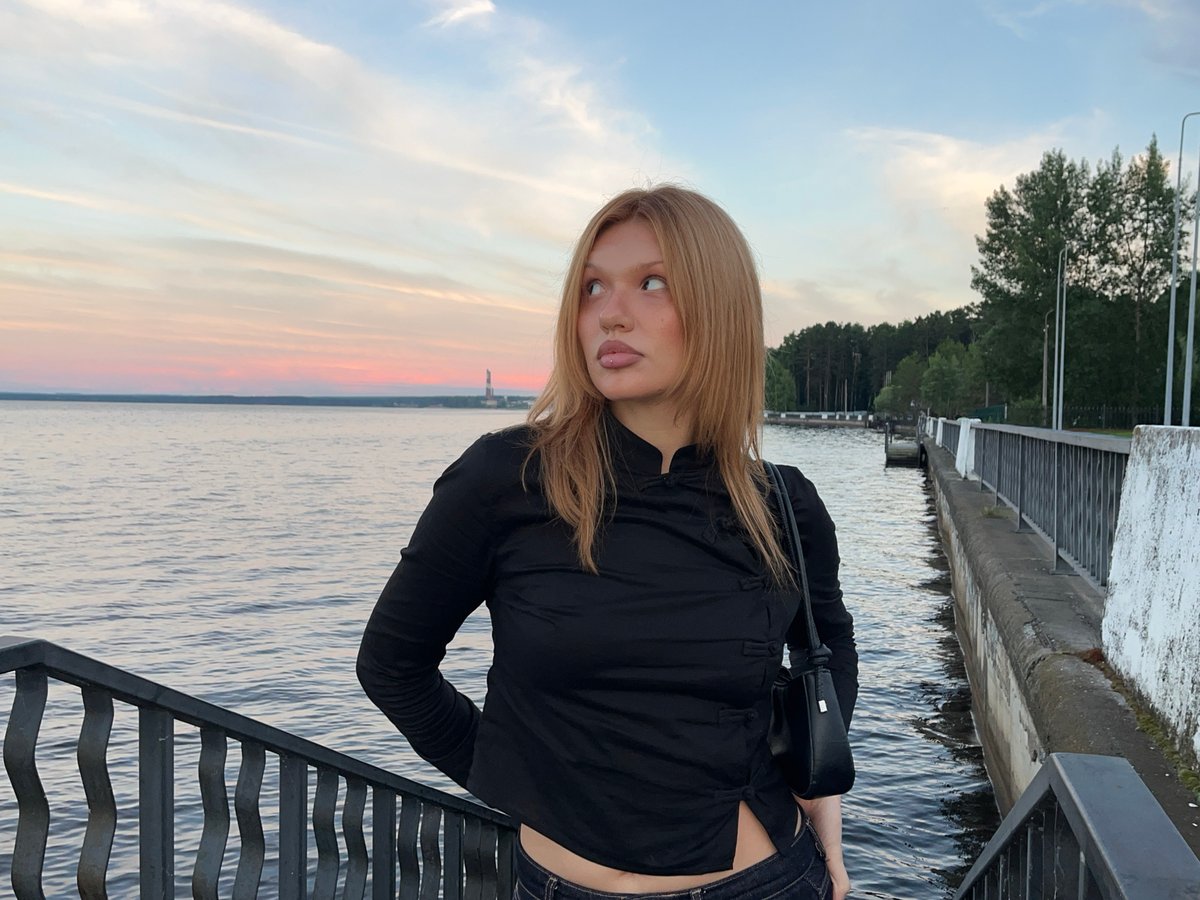 Afternoon stroll with a Pomeranian along Chaikovsky's waterfront