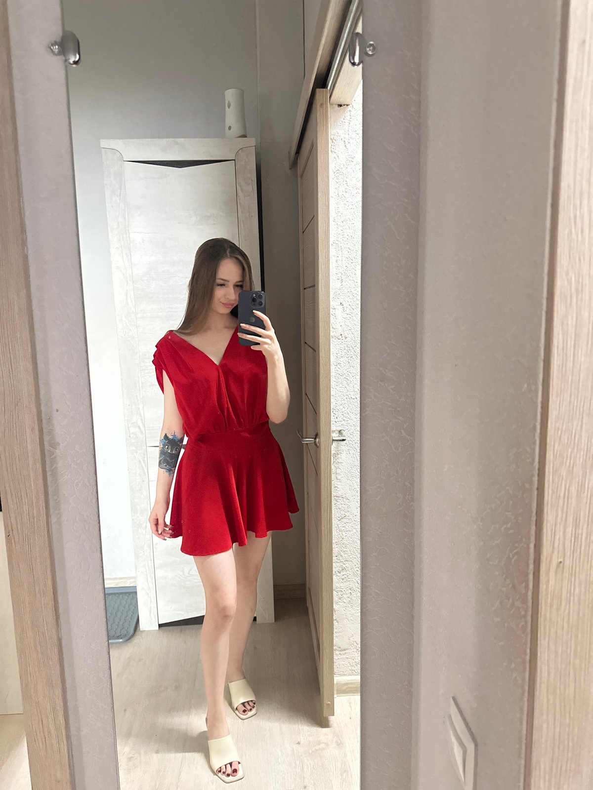 Mirror selfie session in red dress across bedroom kitchen