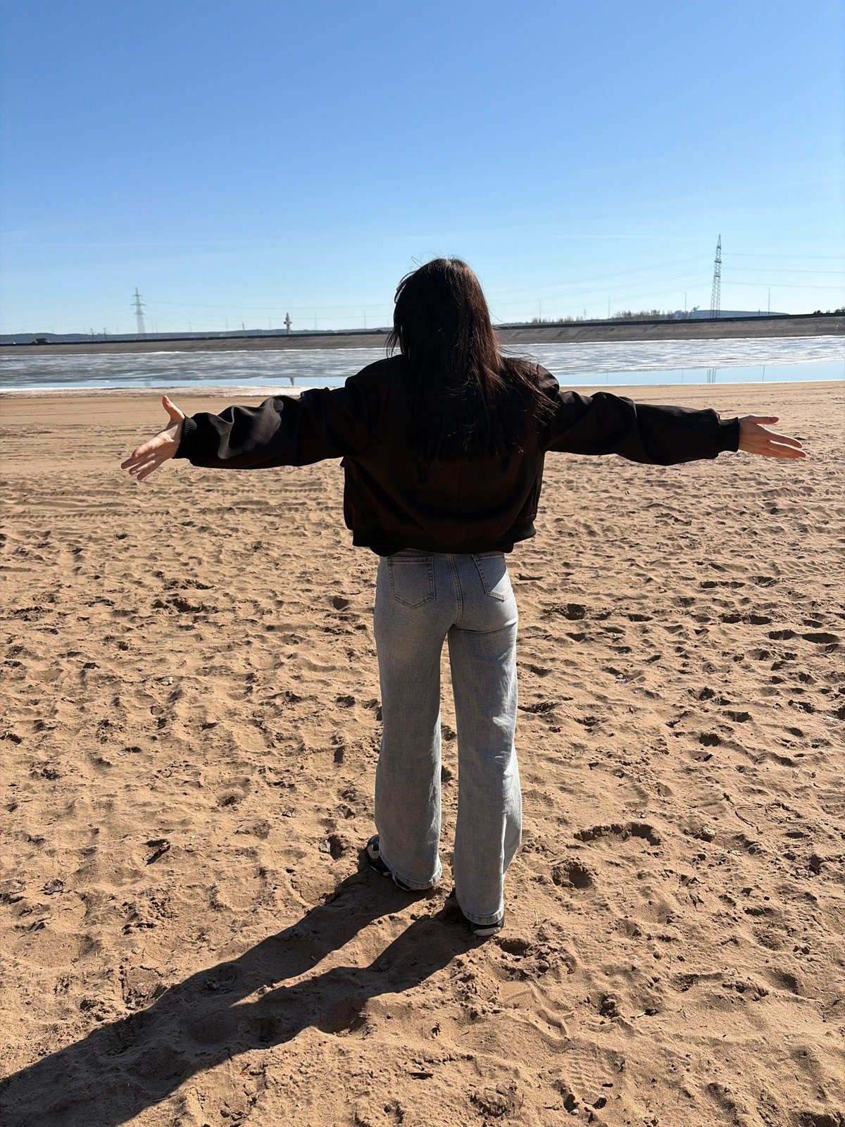 Beach day documented in Noviy, Russia with photography and sand art