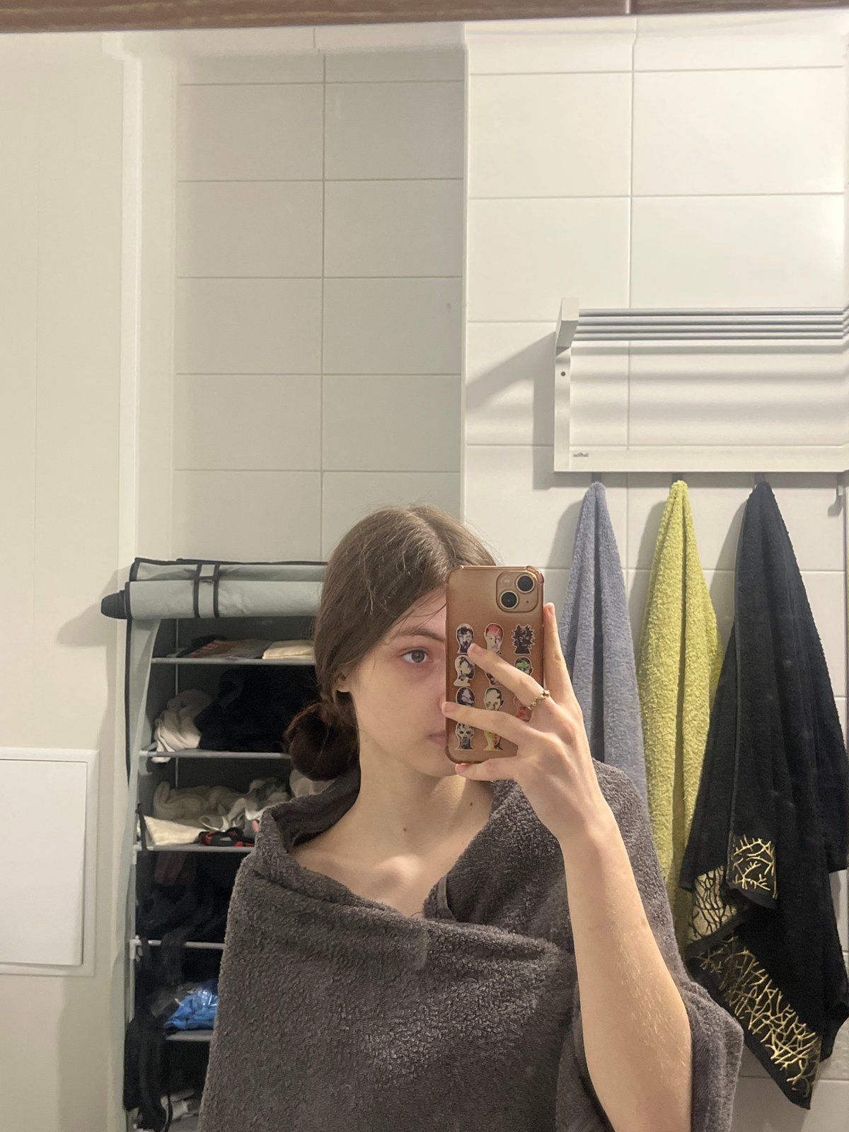 Person takes bathroom mirror selfies in Saint Petersburg