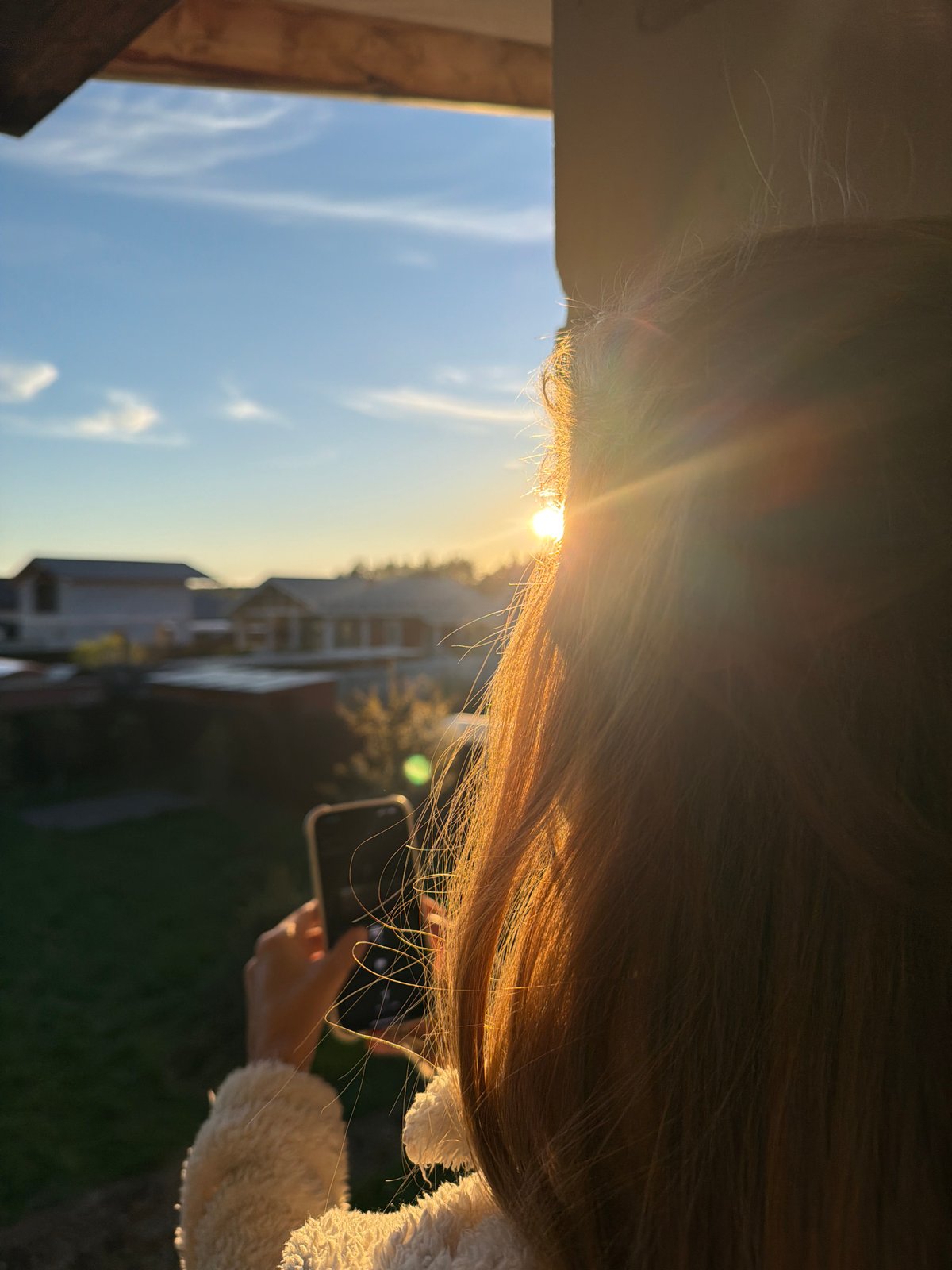Person captures sunset with smartphone in Russian Kerro Massiv