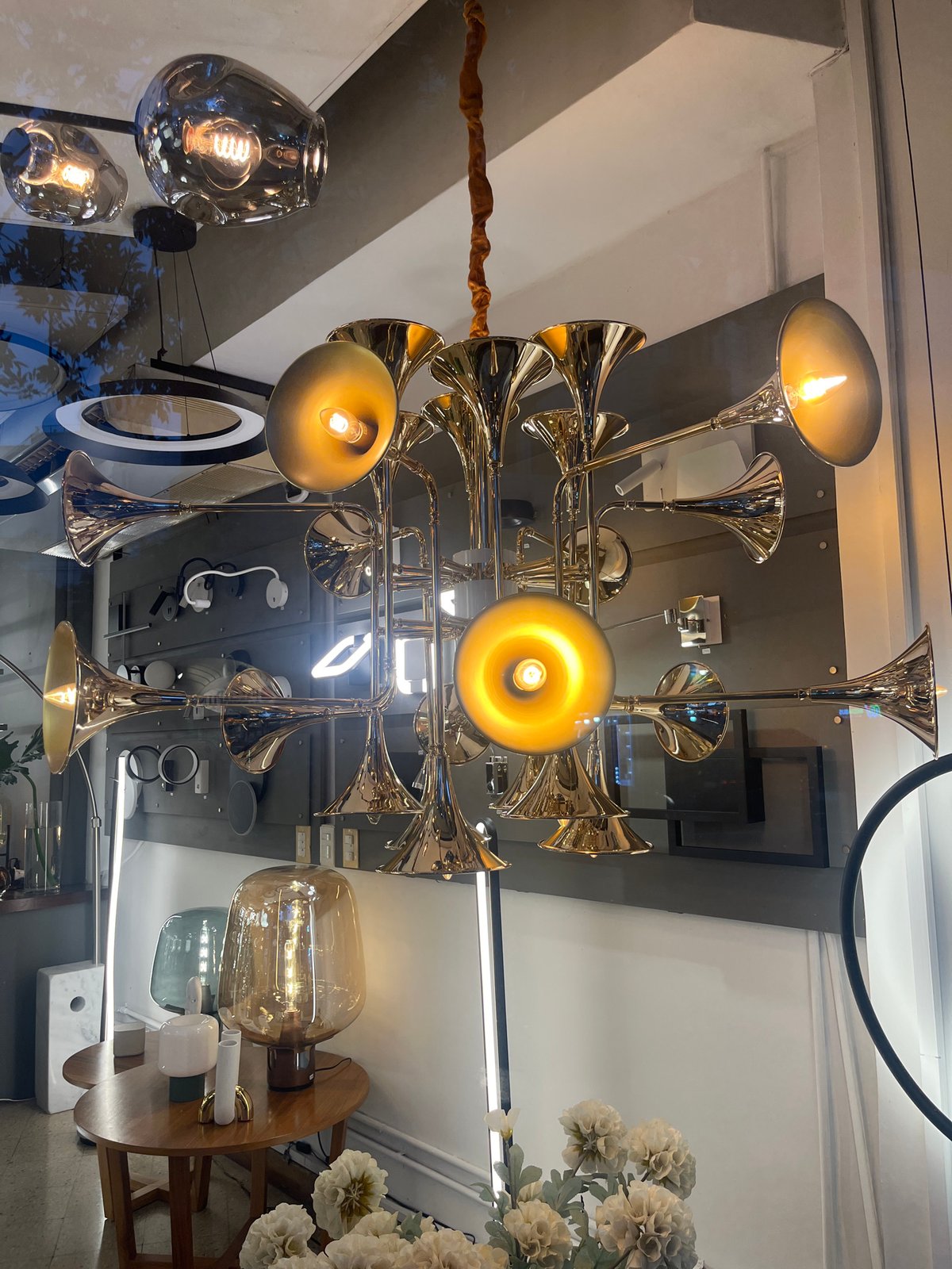 Visitor documents lighting displays at Buenos Aires design showroom