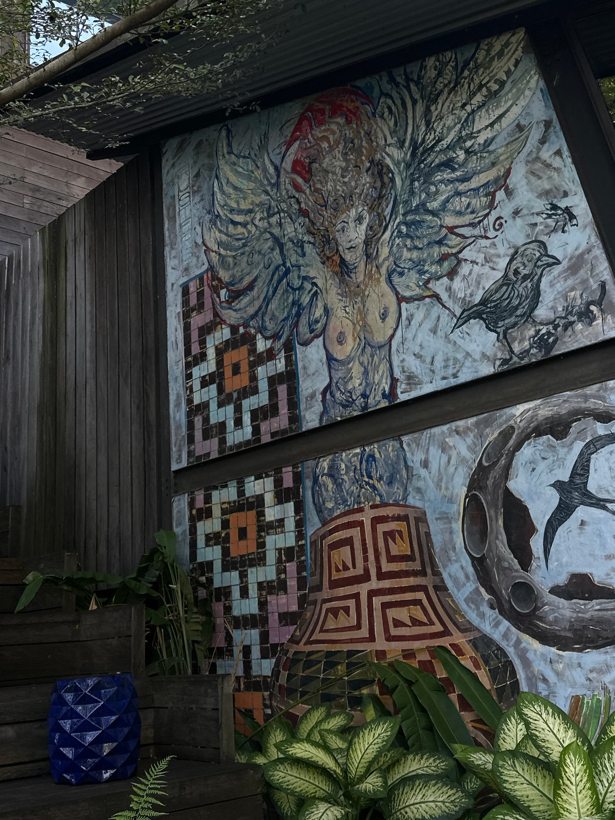 Diner documents ornate restaurant murals and courtyards in Singakerta