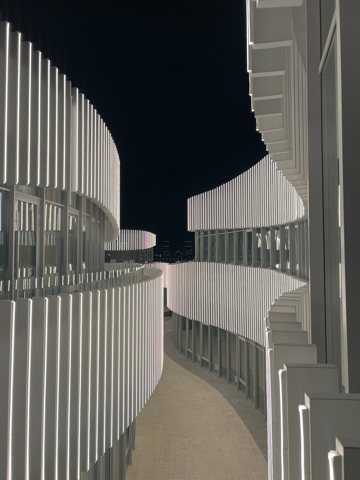 Nighttime architectural photography captures illuminated Kazan cityscape