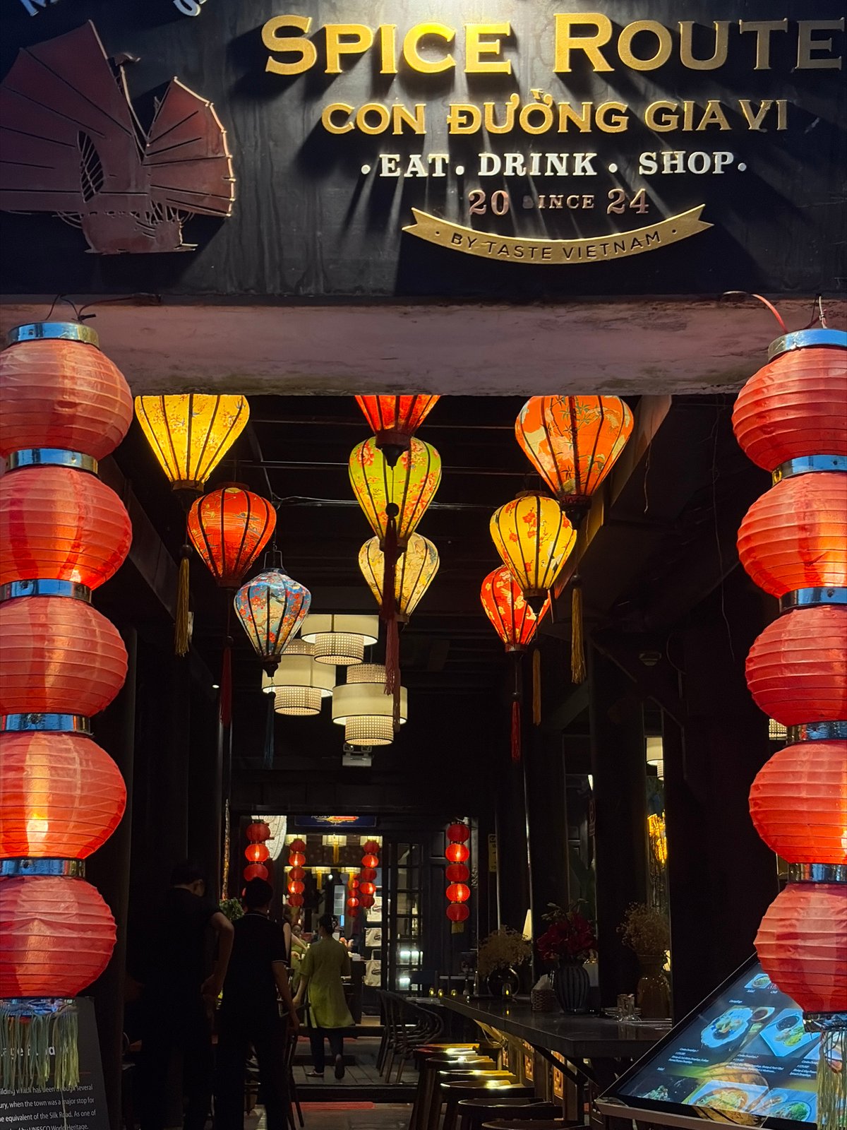Family enjoys evening lantern festival atmosphere in historic Hội An