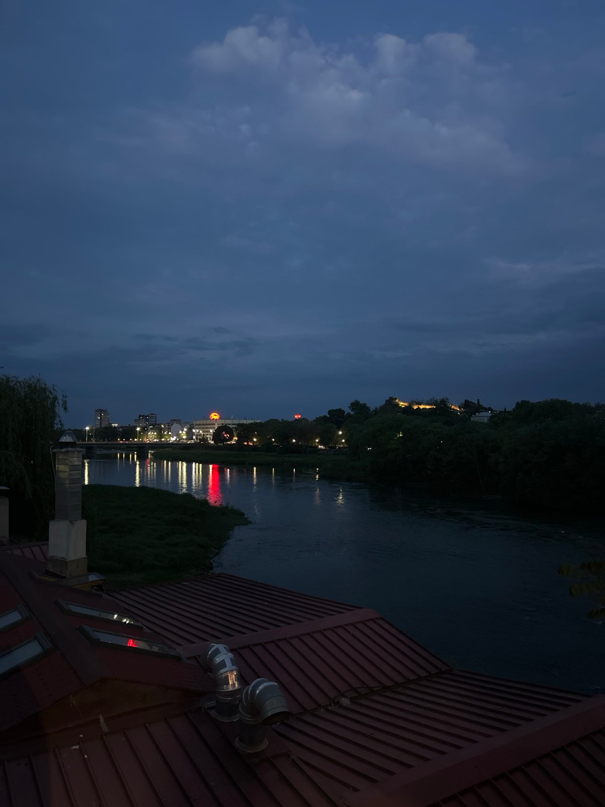 Evening scenes captured across Plovdiv include skyline views, novelty candles