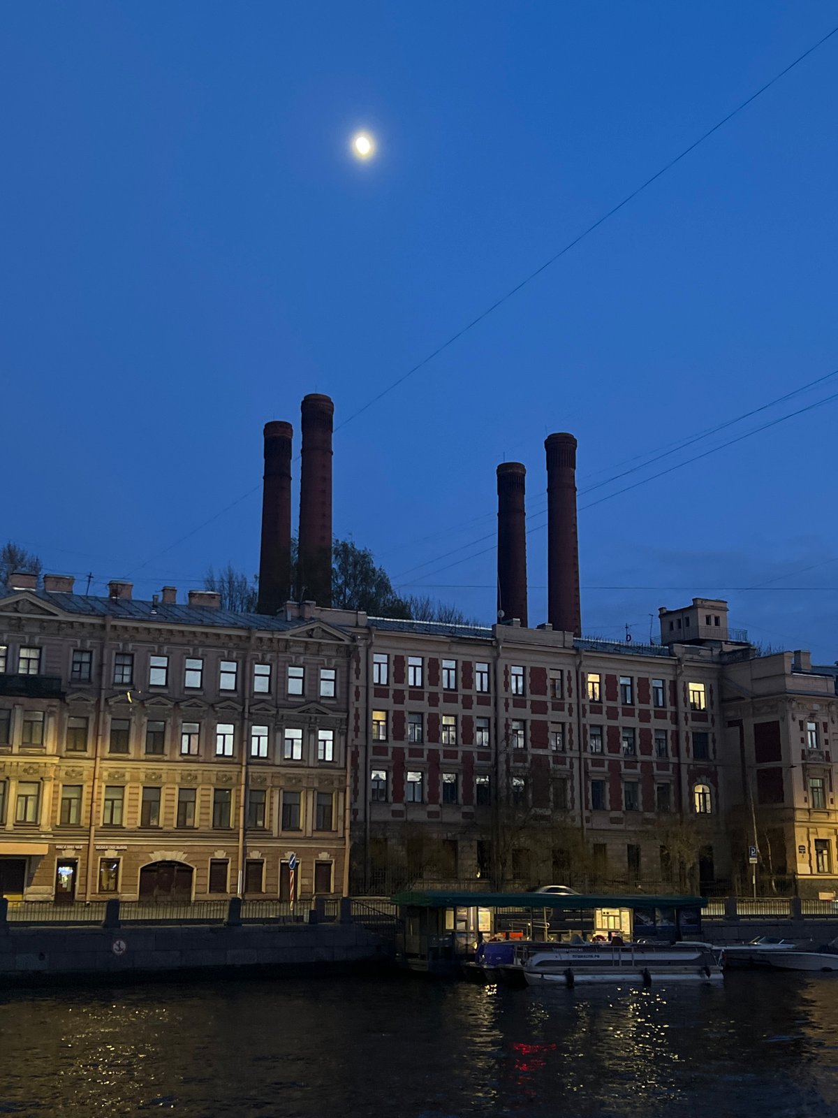 Evening moon rises over Saint Petersburg waterfront walkway