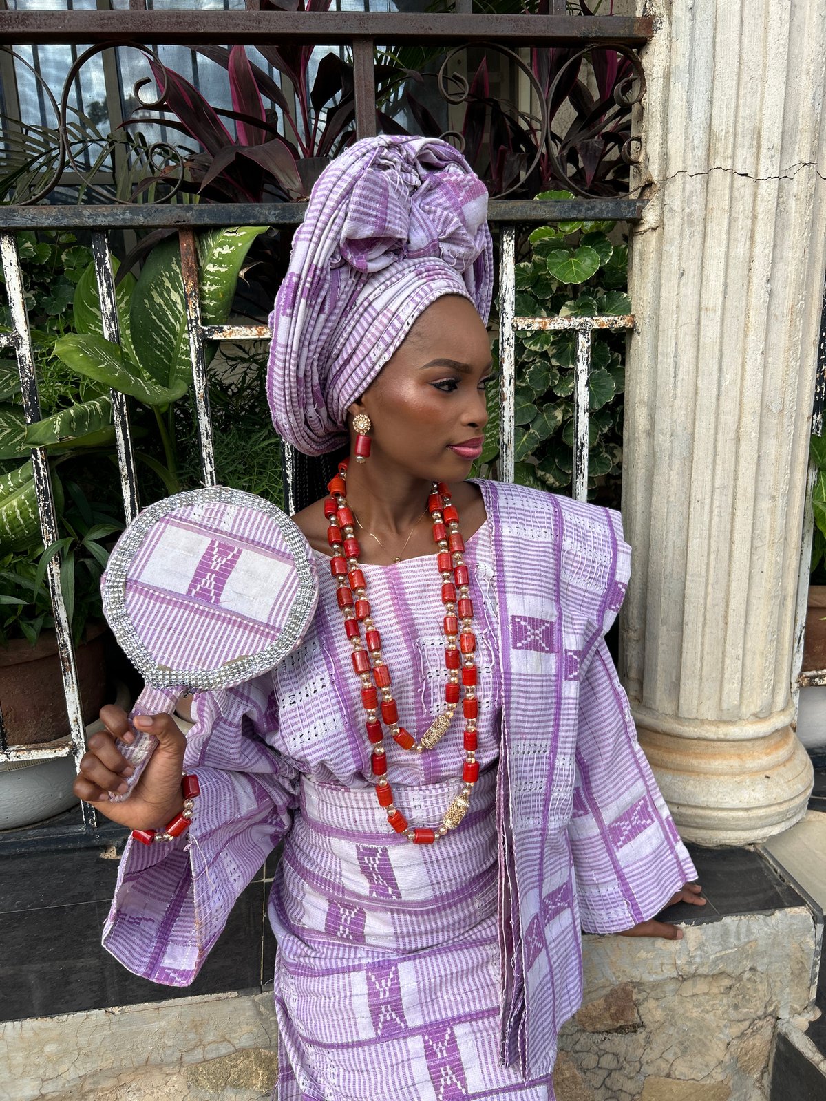 Portrait session in traditional African attire with decorative mirror