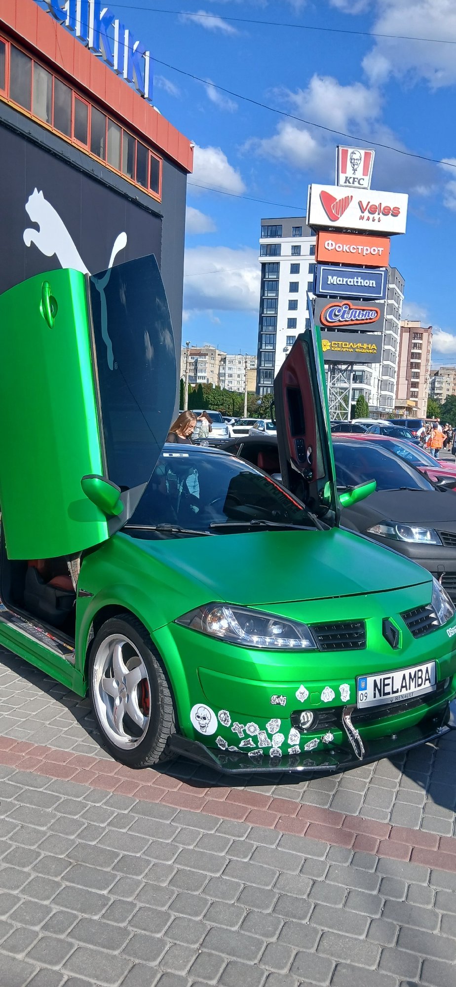 Colorful classic and sports cars at what looks like a car meet