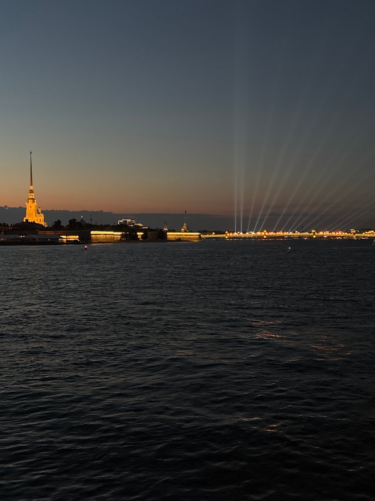 Saint Petersburg's waterfront landmarks glow during a late-night light show