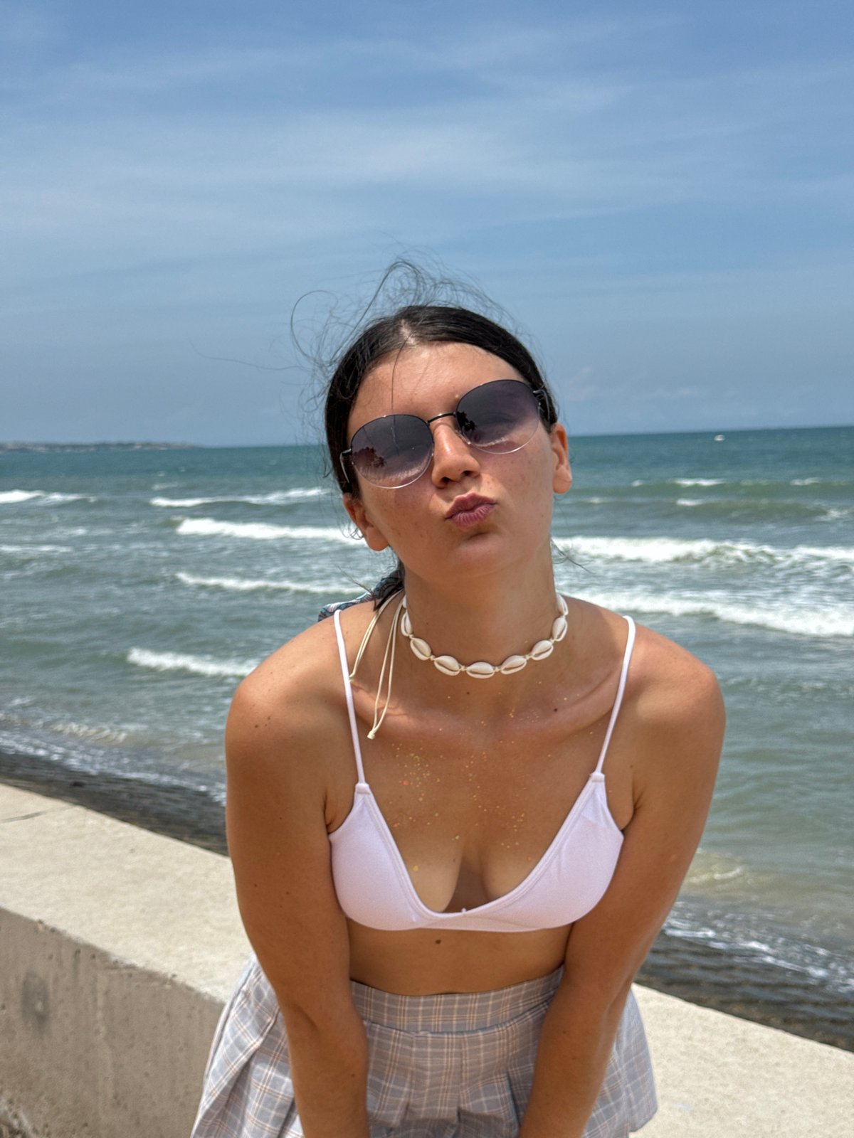 Woman poses oceanside in bikini at Vietnam coast