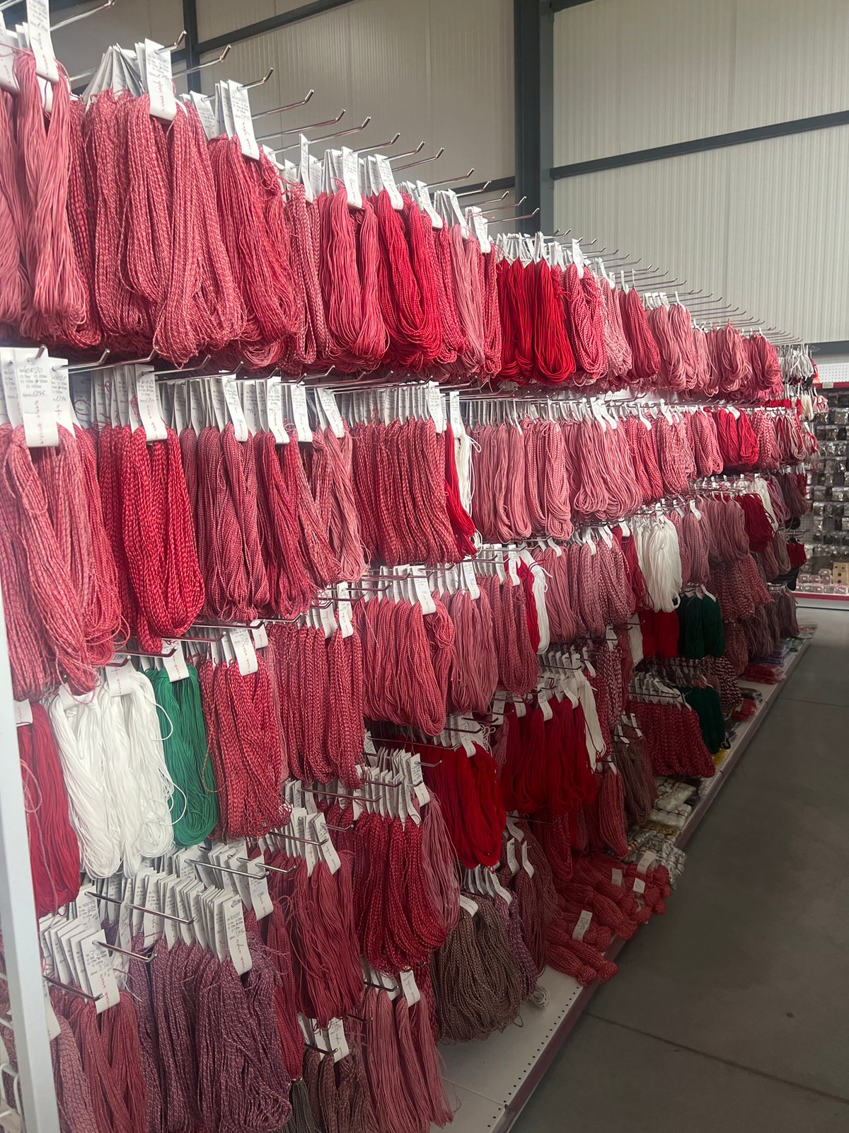 Textile warehouse stocked with red embroidery thread in Burgas