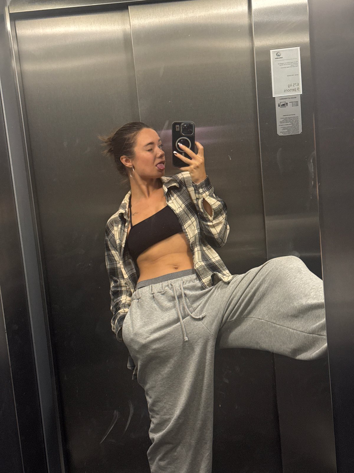 Woman takes elevator selfies, cat naps on bench in Budva