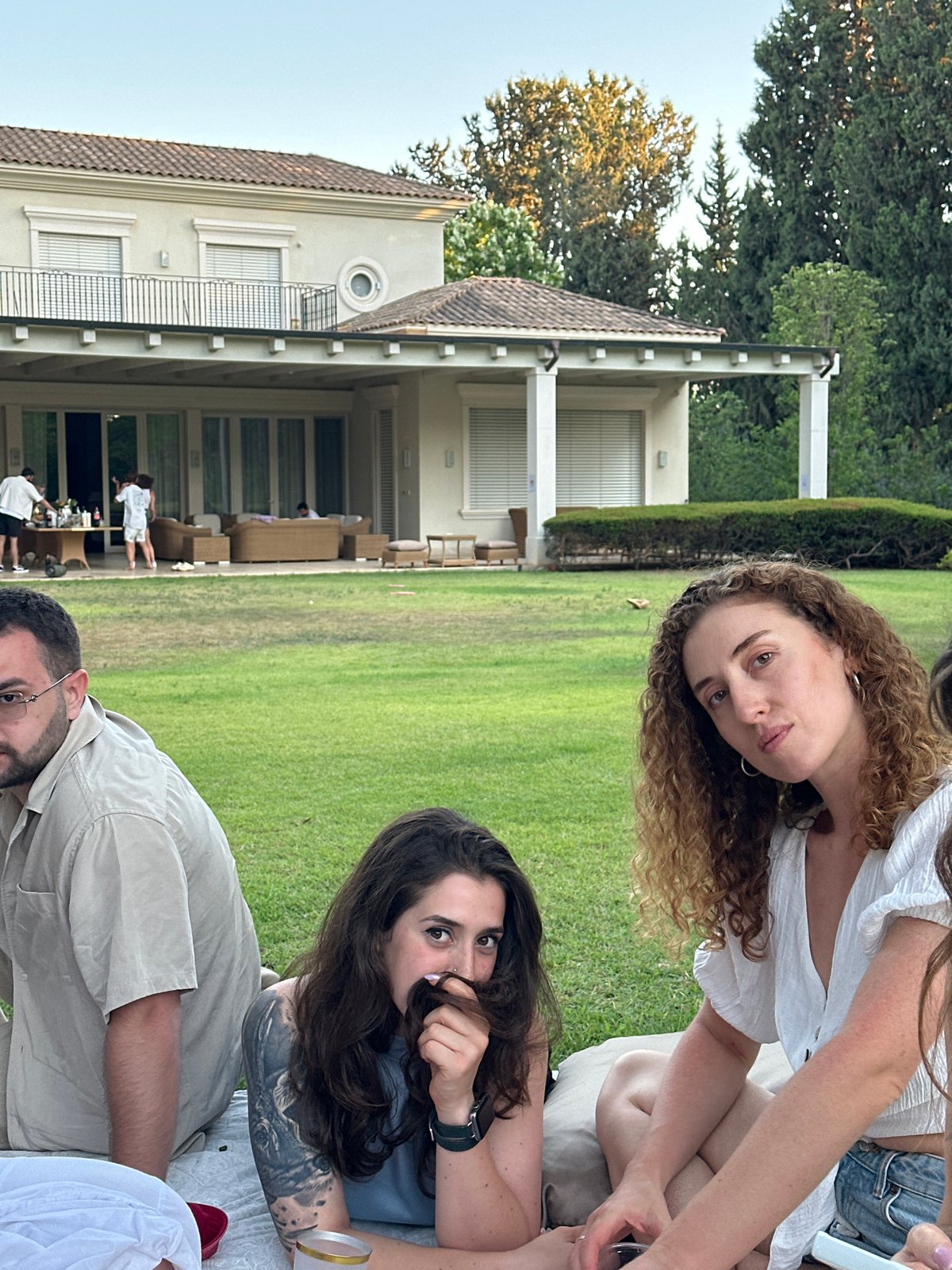 Outdoor birthday party at a Savyon villa, cake and sparklers