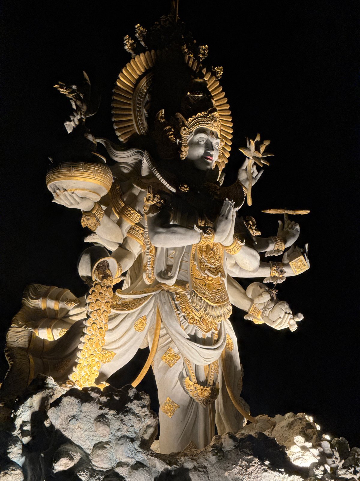 Multi-armed golden statue observed in North Kuta, Indonesia