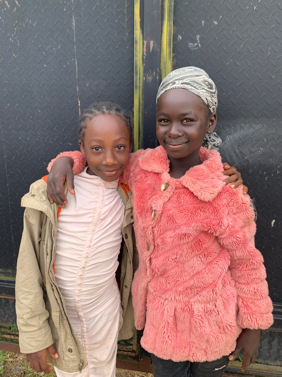Morning street life in a Jos, Nigeria neighborhood