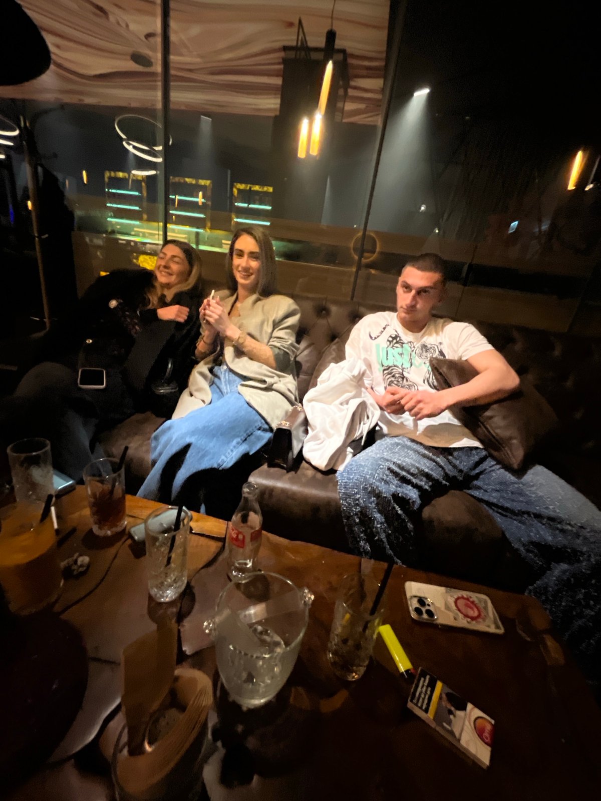 Three friends gather at Burgas bar lounge