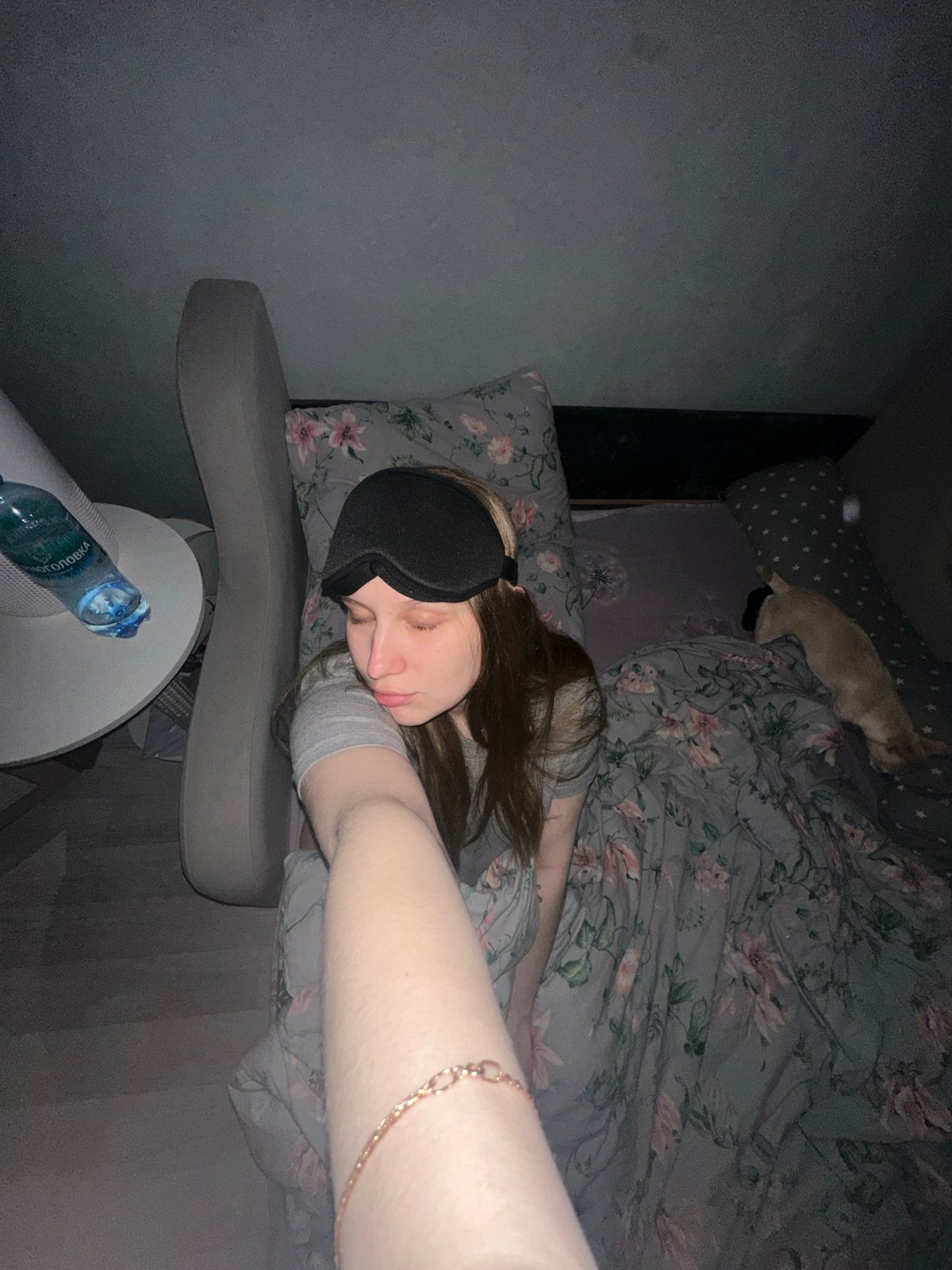 Woman rests with sleep mask in Chaikovsky bedroom